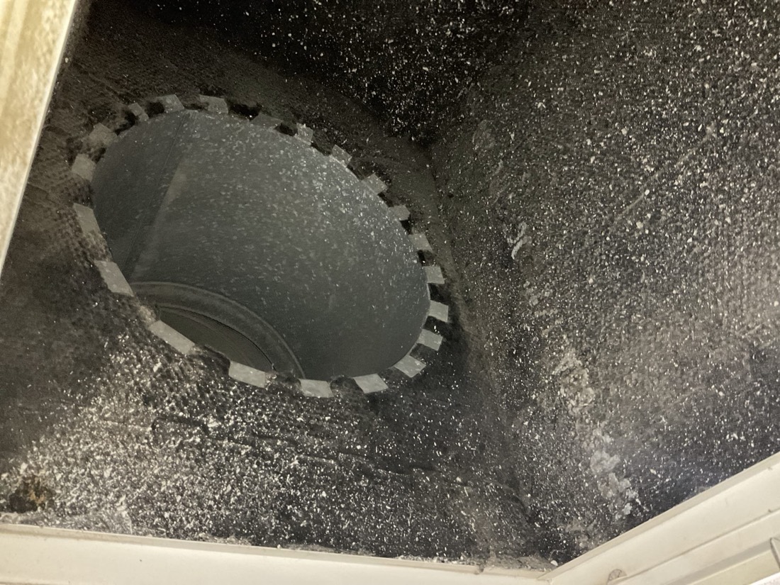 Clean duct opening with damper visible inside ductwork