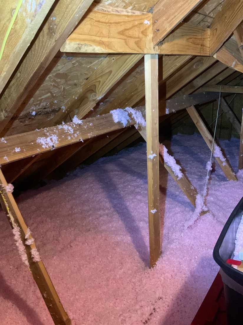 Completed attic insulation with proper framing supports