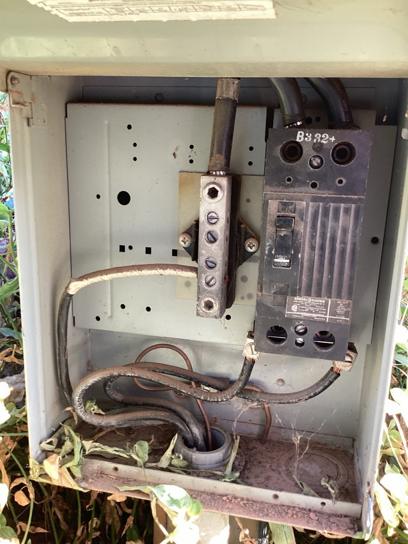 Interior view of electrical panel showing installed circuit breakers and wiring.