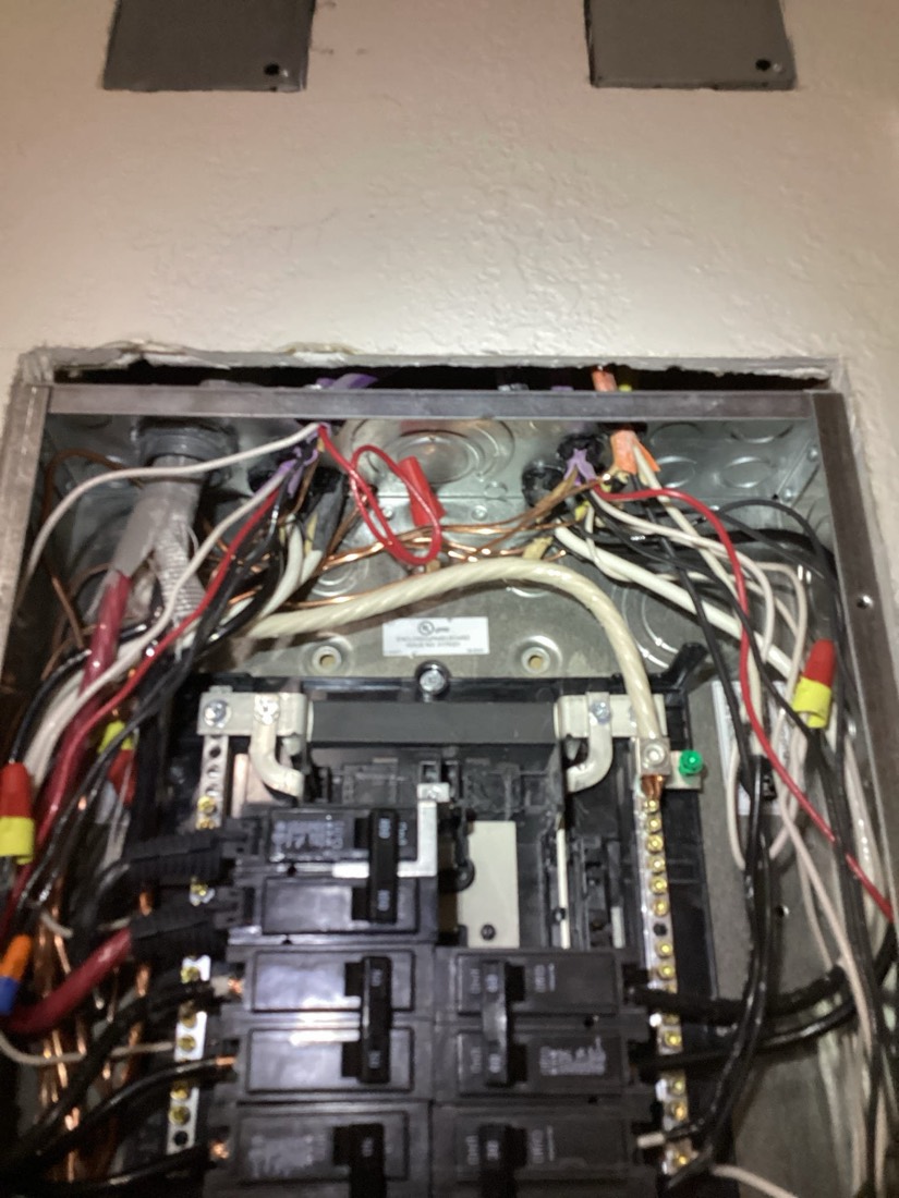 Electrical service panel interior with organized circuit breakers and wiring