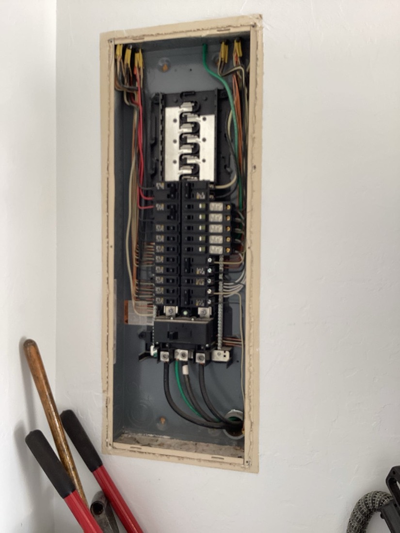 Upgraded electrical panel with organized breakers and wiring