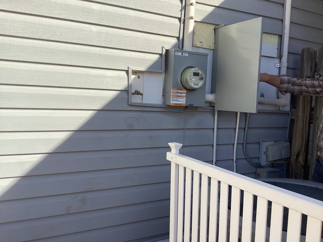 Electrical meter and service disconnect installed on exterior
