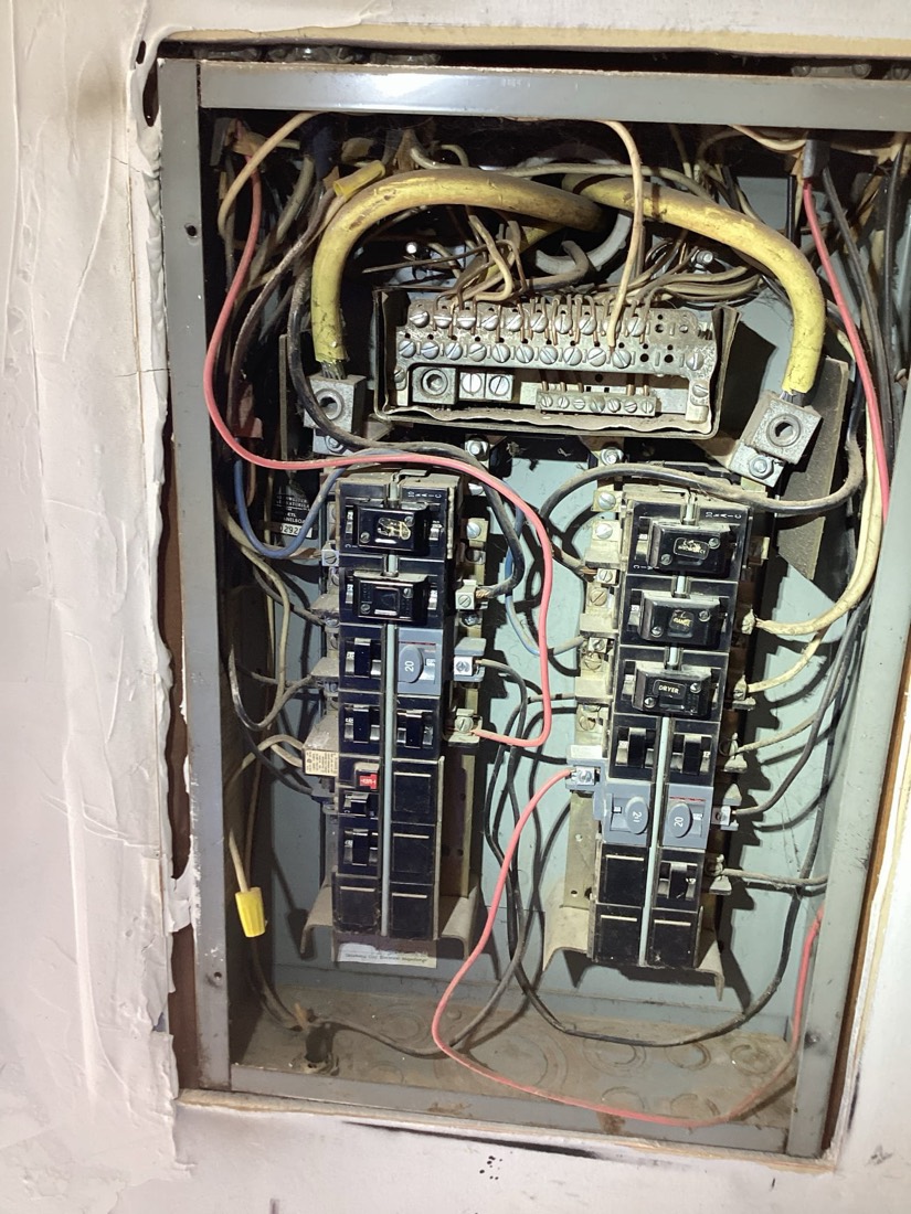 New electrical panel installation with properly organized wiring and breakers.