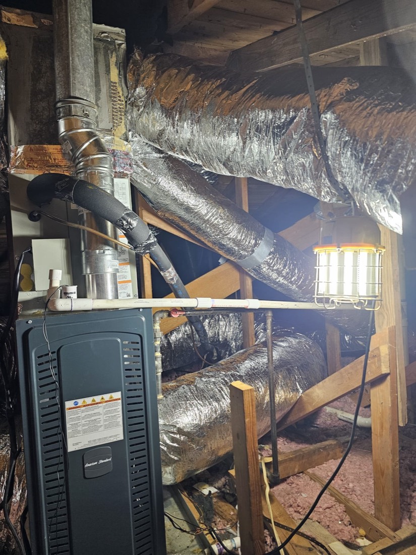 Installed air handler with properly insulated ductwork in attic