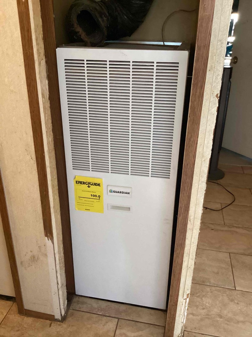 Guardian mini-split AC unit with EnergyGuide label installed inside home