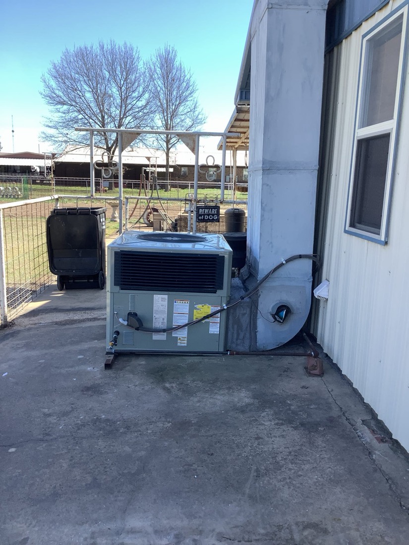 Completed HVAC outdoor condensing unit and indoor air handler installation